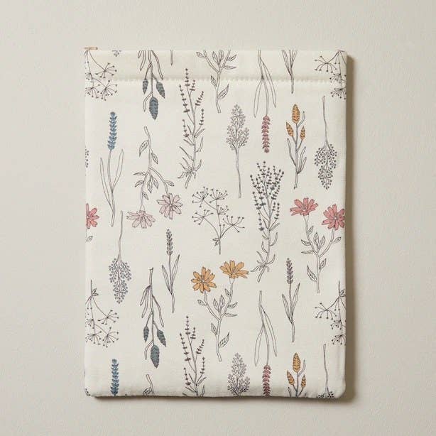 the pouch covered in a wildflower print against a plain background