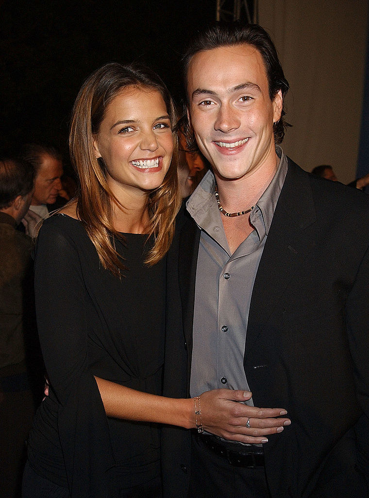 Katie Holmes and Chris Klein with their arms around each other