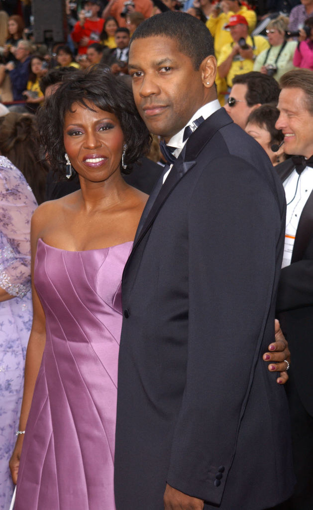 denzel and pauletta on a red carpet