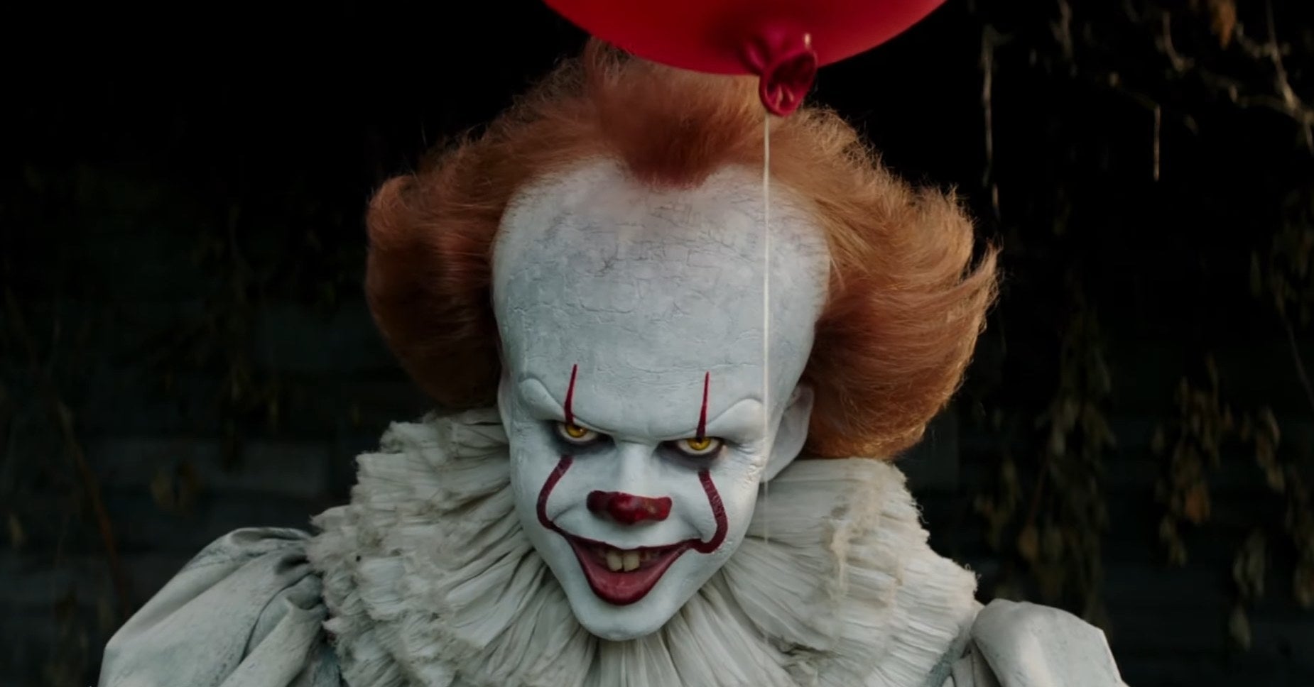 Pennywise the Dancing Clown with a red balloon over Its head in &quot;It&quot;