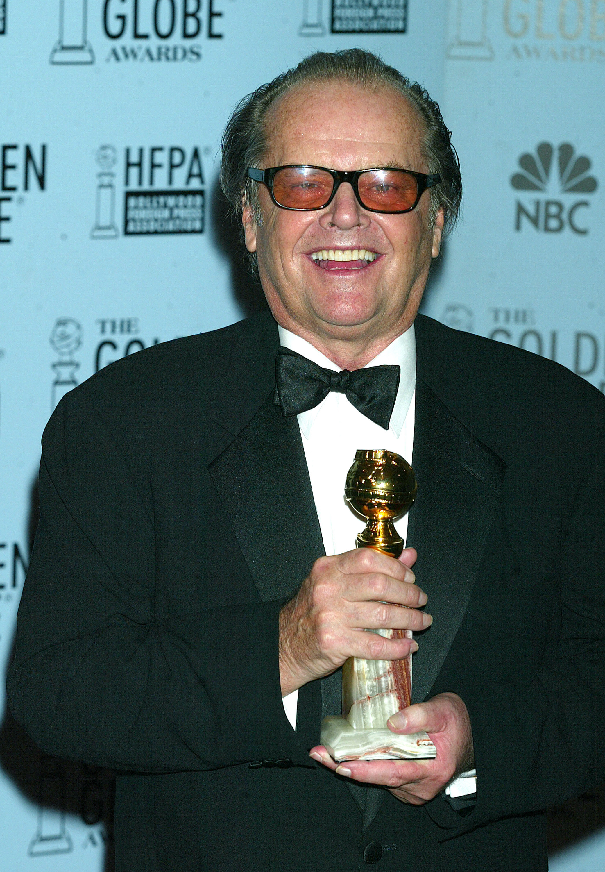 Jack Nicholson holding a Golden Globe award
