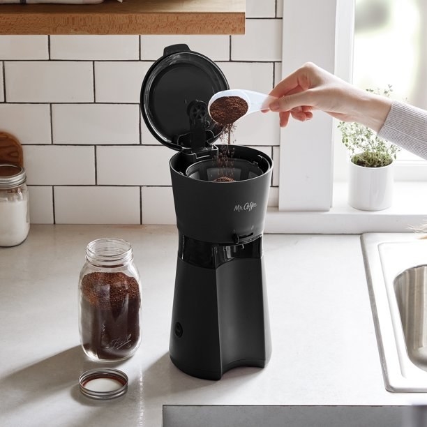 An iced coffee maker with reusable tumbler and coffee filter