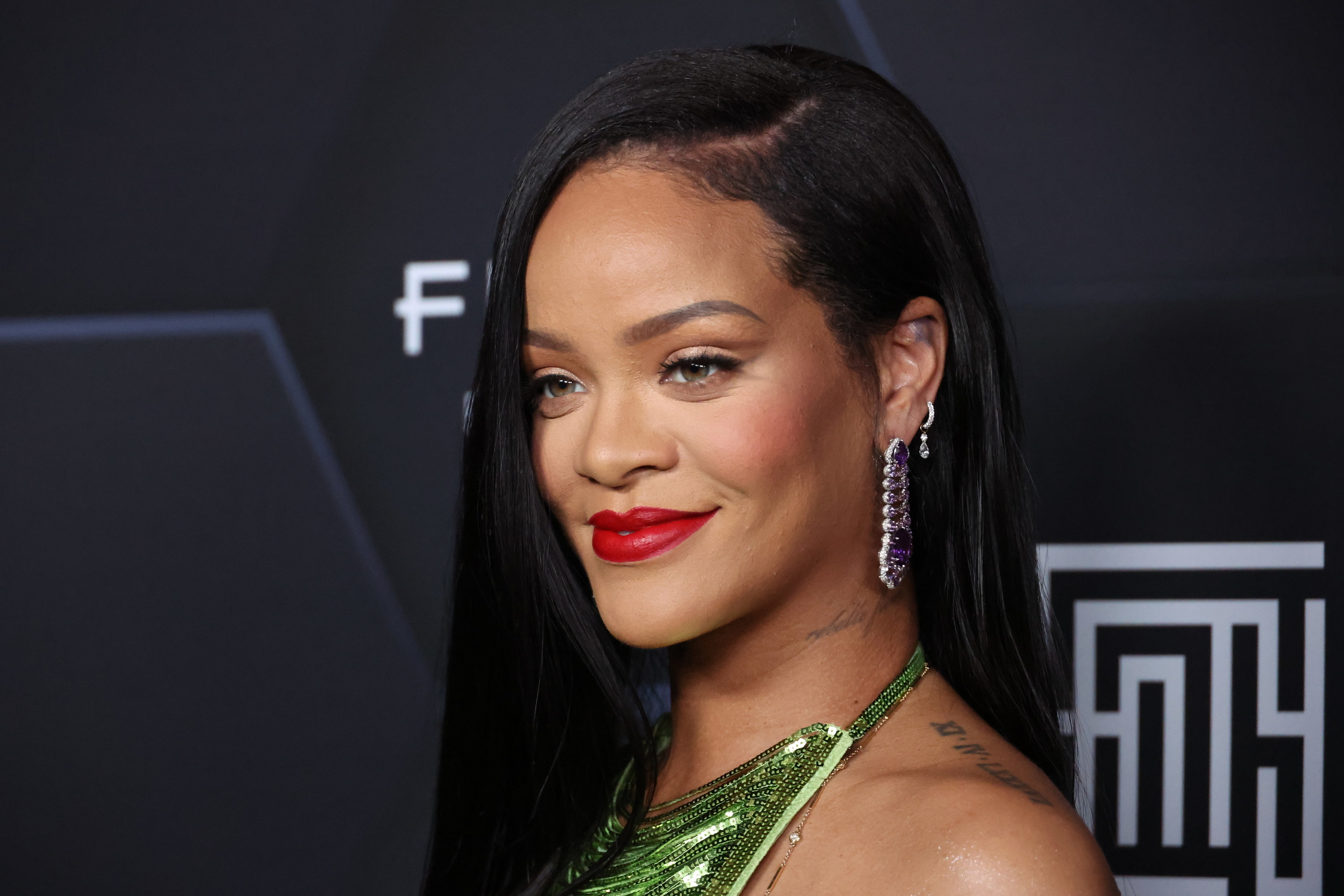 Rihanna smiling at an event