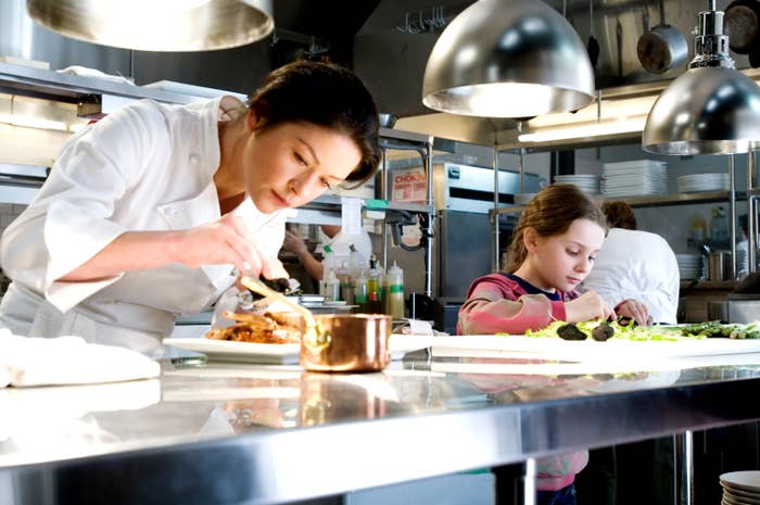 A woman and a child cooking in a restaurant in &quot;No Reservations&quot;
