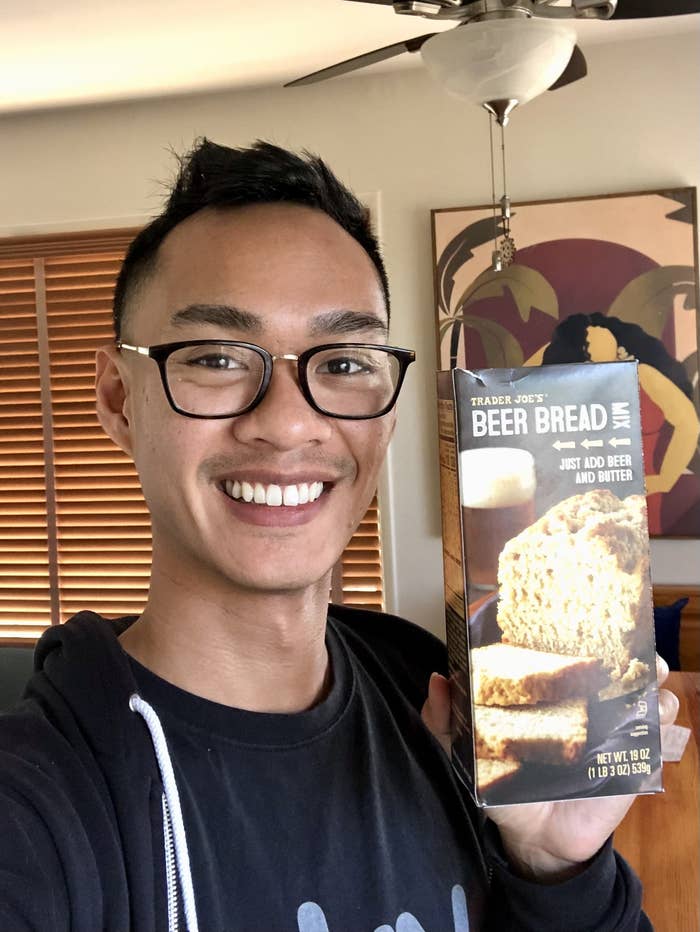 Author holding a beer bread mix box