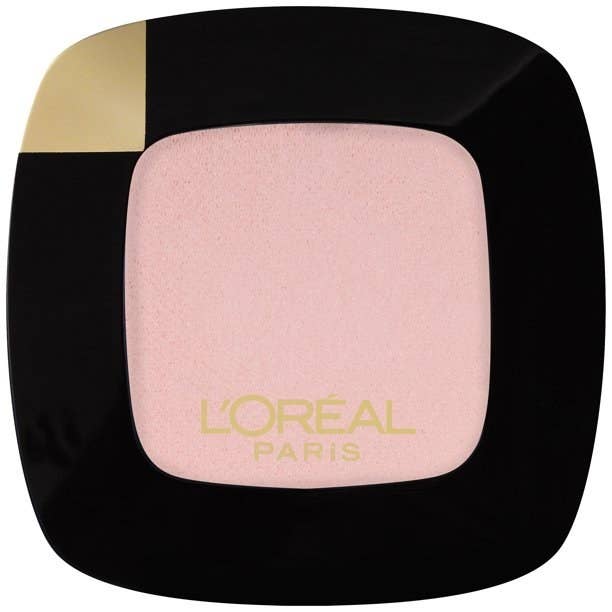 A pink eyeshadow in a black and gold packaging