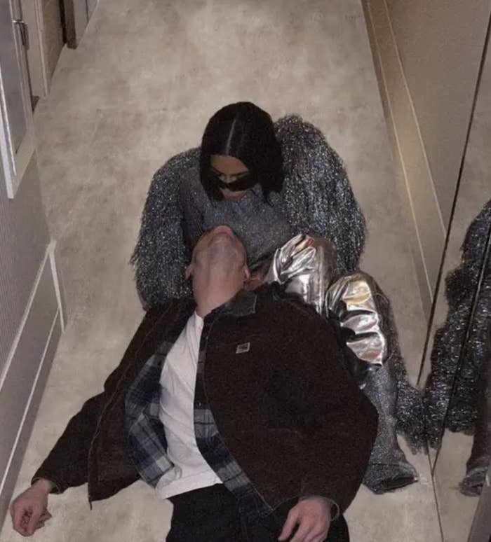 Pete laying on Kim as they sit on the floor