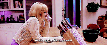 GIF of Drew saying &quot;What&#x27;s your favorite scary movie?&quot;
