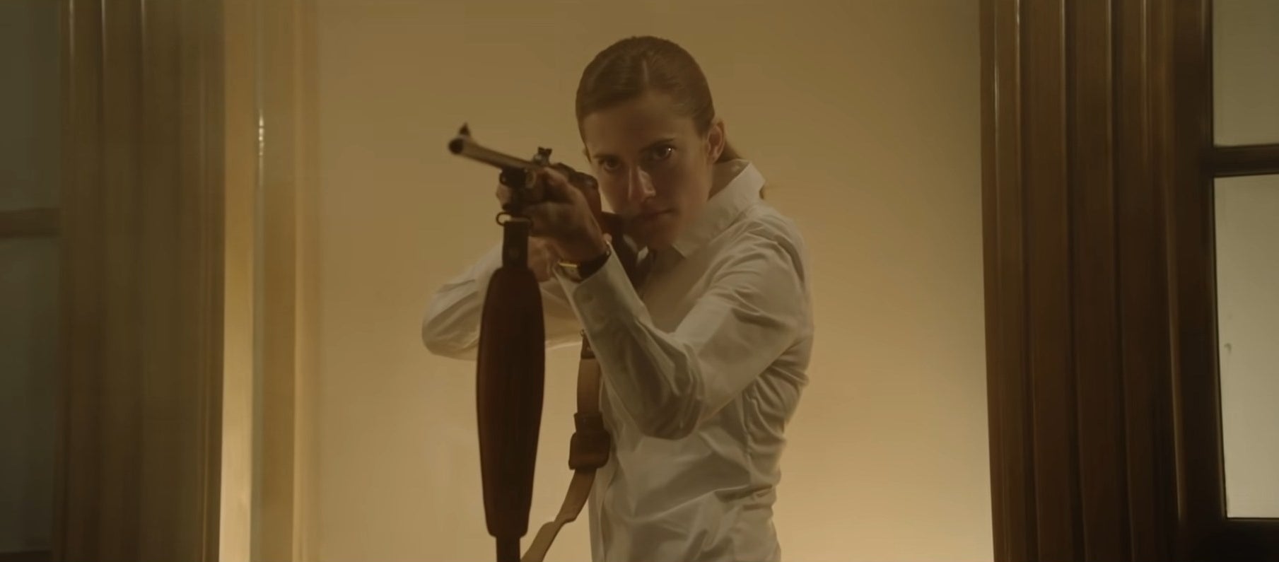 Rose holding a shotgun at her doorstep in "Get Out"