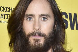 Leto looks at the camera with long hair