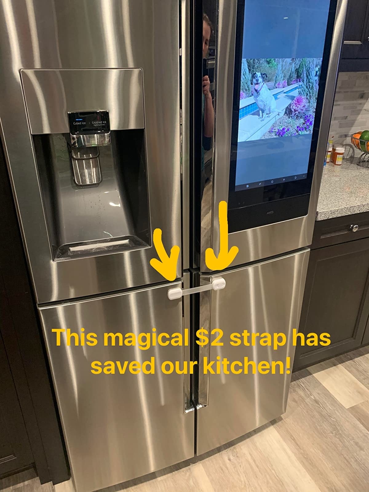reviewer's photo of the safety straps installed on their fridge