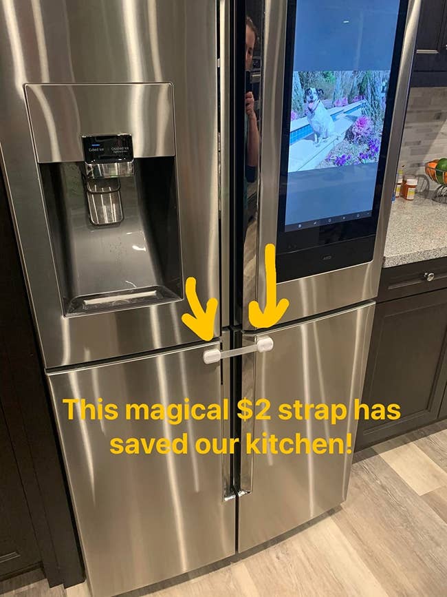 reviewer's photo of the safety straps installed on their fridge
