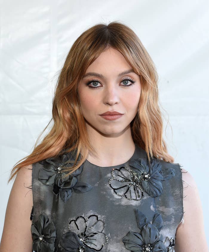 Sydney Sweeney wearing a flowered, sequined shirt