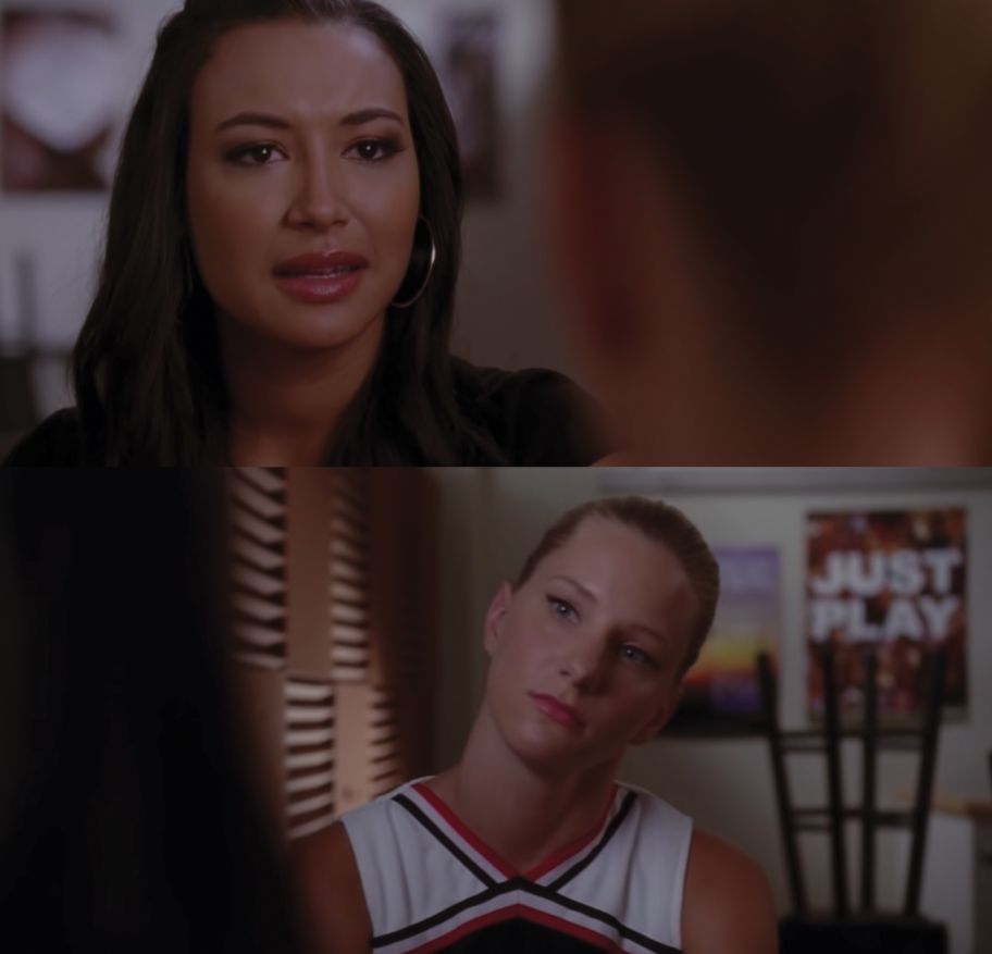 A close up of Santana Lopez as she sings and Brittany Pierce with her head turned to the side