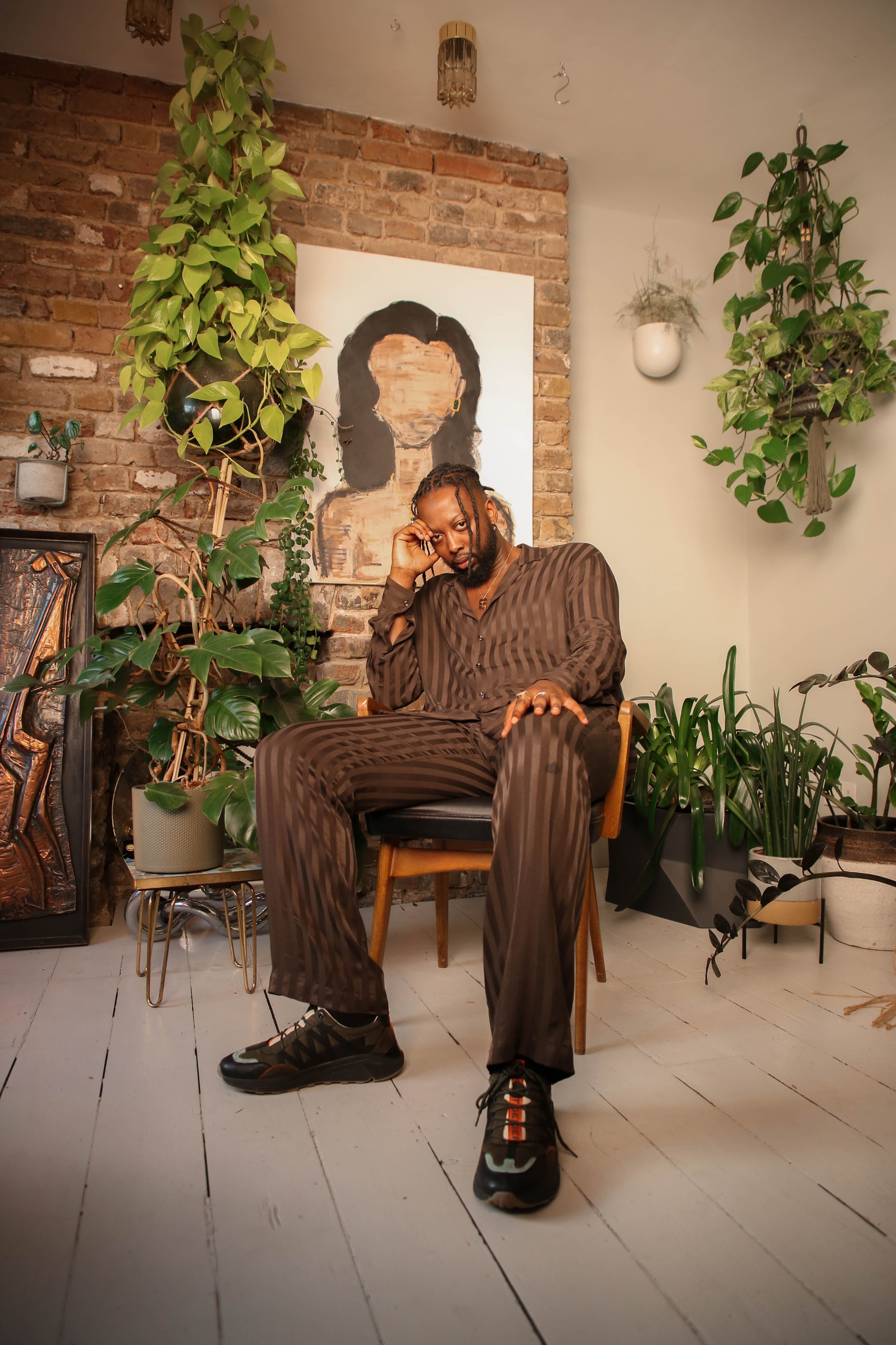 ibrahim kamara posing on chair