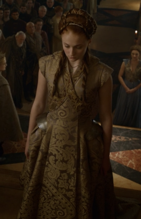 Joffrey escorting Sansa in her wedding dress