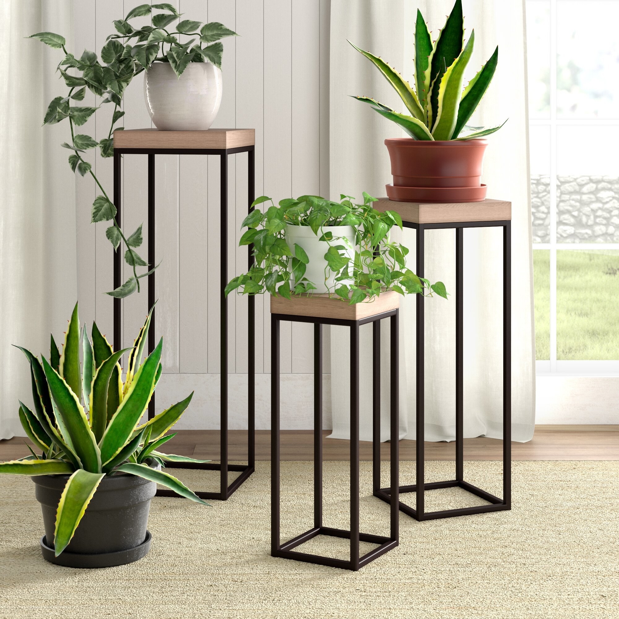 the three plant stands with metal legs and wooden tops