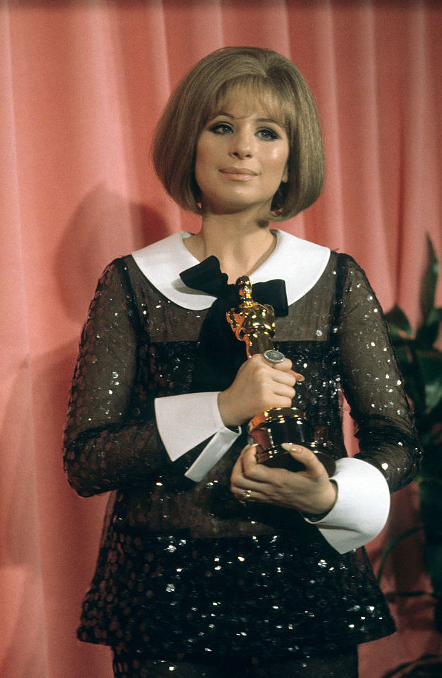 Streisand holding her Oscar