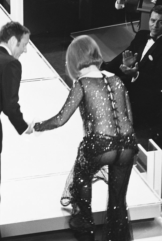 Streisand going onstage, her butt visible through her transparent outfit