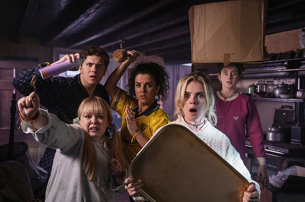 Cast of Derry Girls arm themselves with household objects and stare off in terror