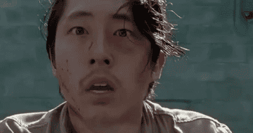 Steven Yeun looking scared on The Walking Dead