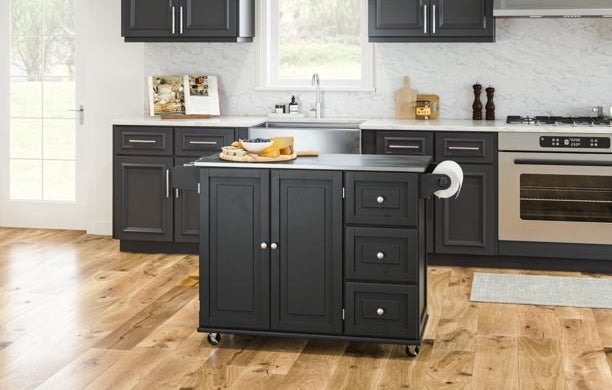 the black cart with a silver top in a decorated kitchen