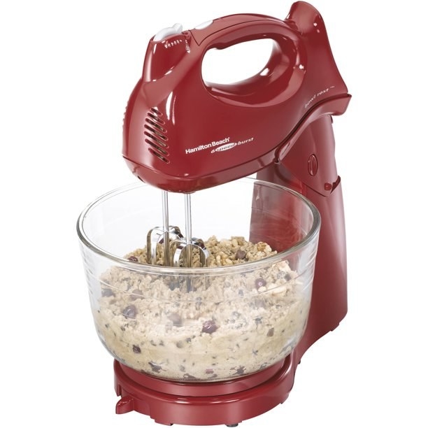 the red stand mixer with a bowl of cookie dough