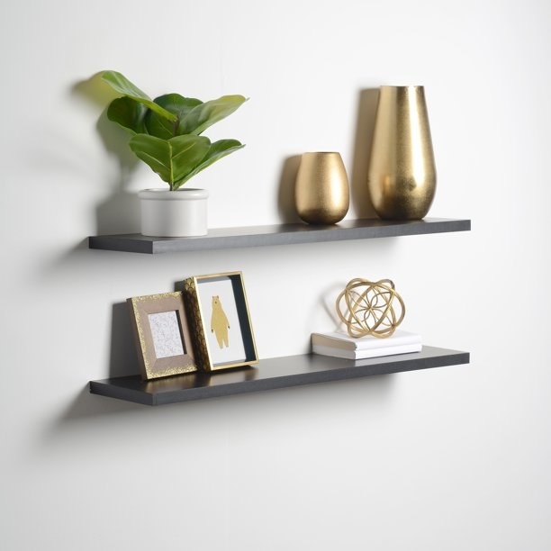the floating wall shelves holding decor