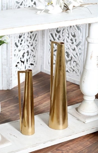 the pitcher vases in a gold color