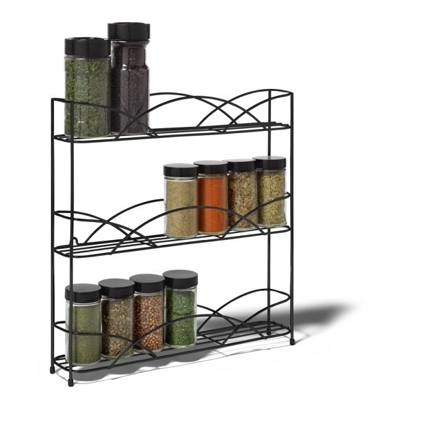 the bottles of spices on the three-tiered metal rack