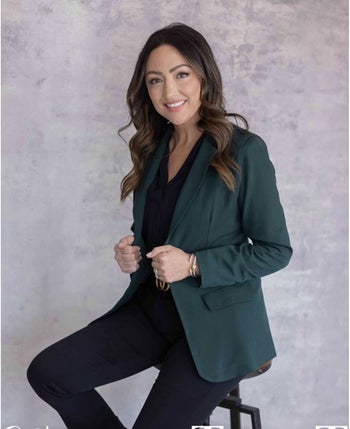 reviewer wearing the blazer in green