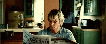 Owen Wilson reading the newspaper and saying, &quot;Wow&quot;