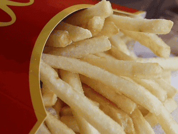 GIF of ketchup dripping onto french fries