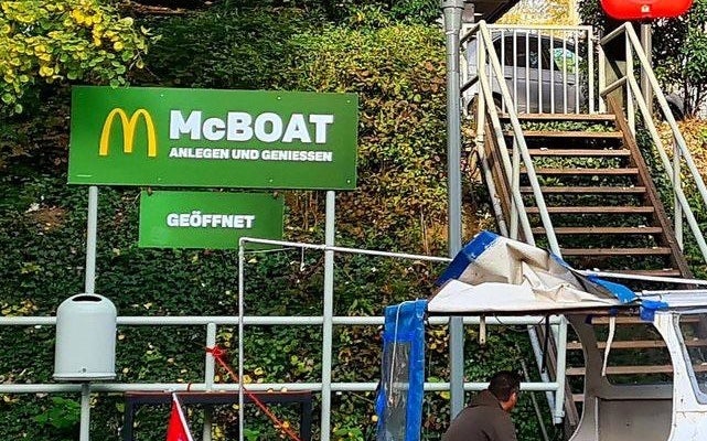 Close-up of a sign that says, &quot;McBoat&quot;