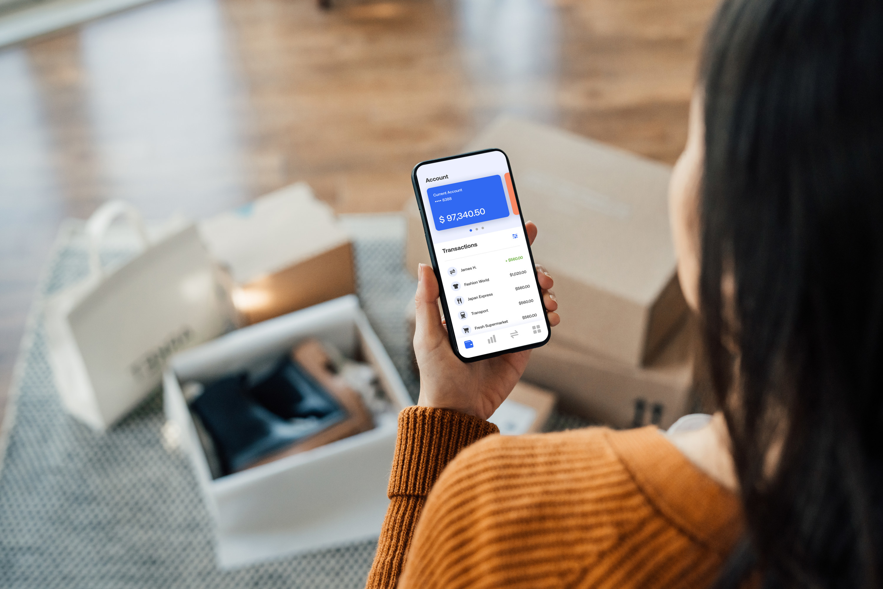 Woman looking at a finance app on her phone