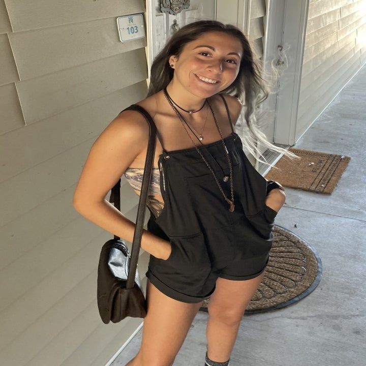 a reviewer wearing the overalls in black