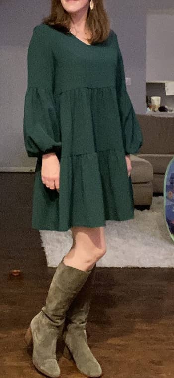 reviewer wearing the tunic dress in green