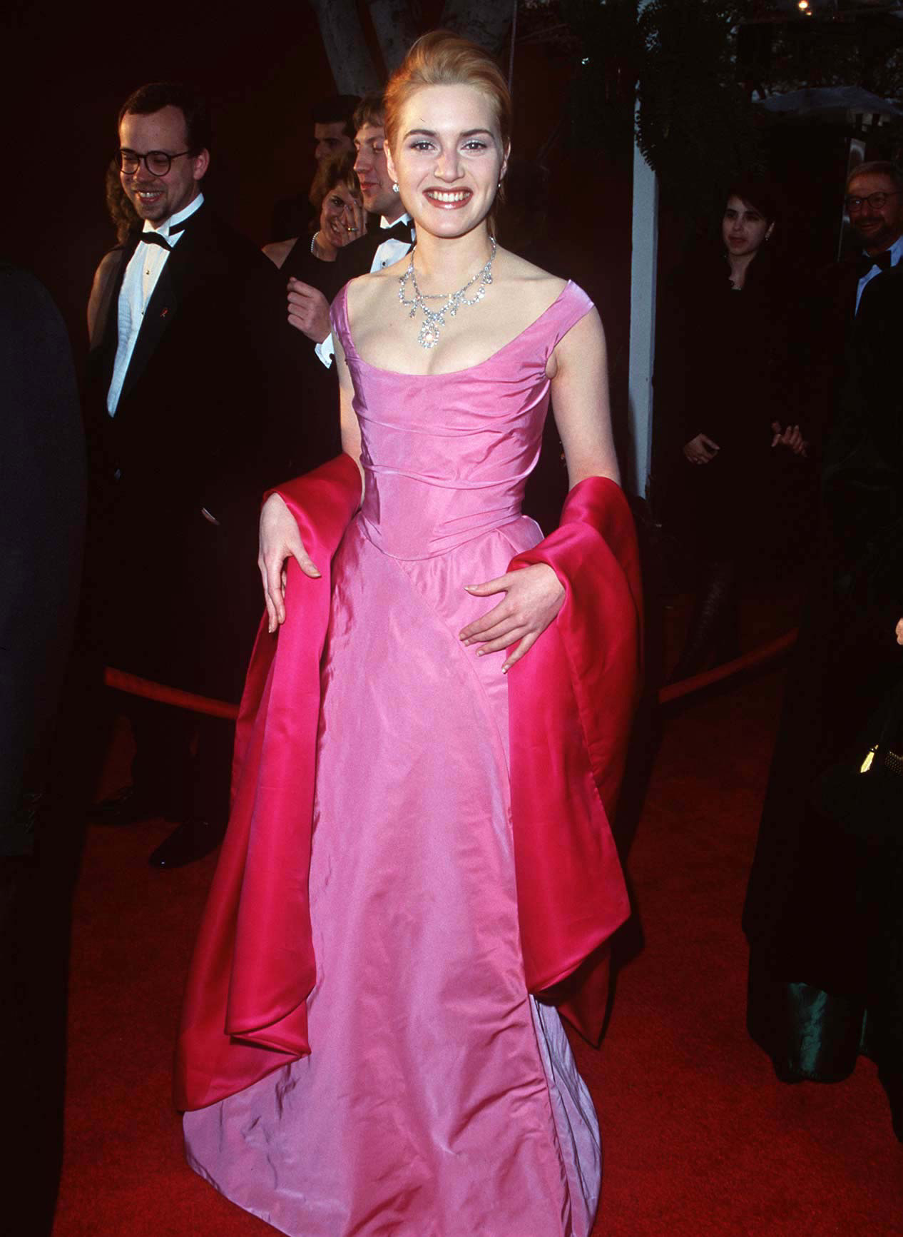 Winslet on the red carpet wearing a pink dress