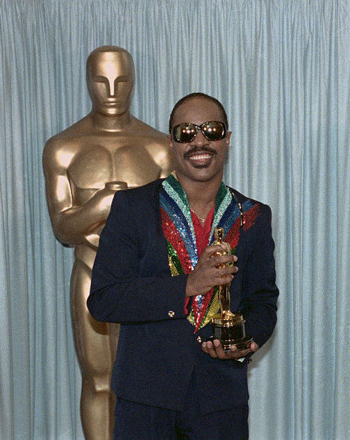 Wonder holding his Oscar backstage