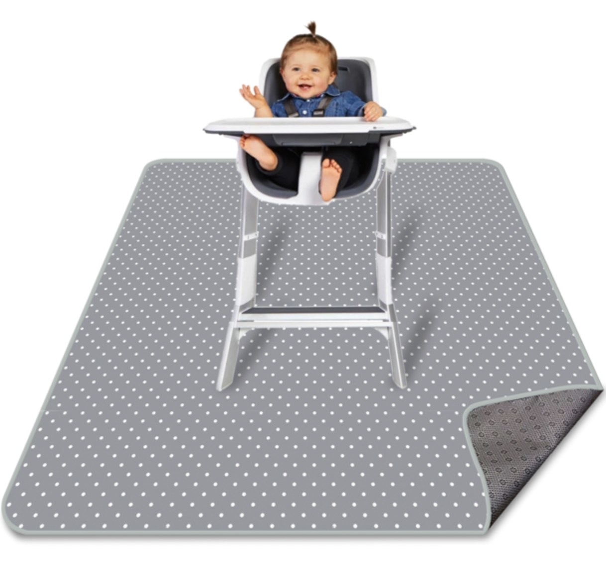Baby in high chair over splat mat