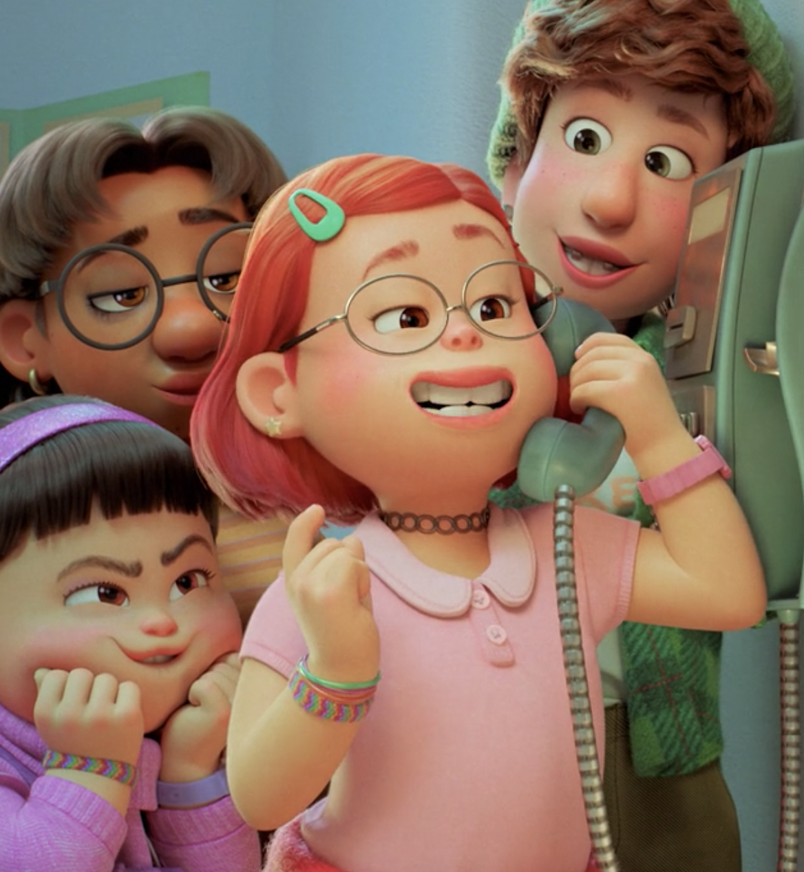 Mei on the phone smiling with her friends standing around her