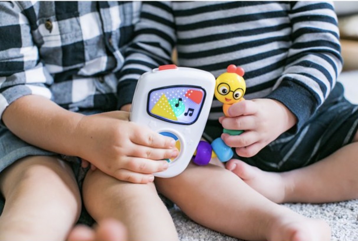Kids holding musical toy