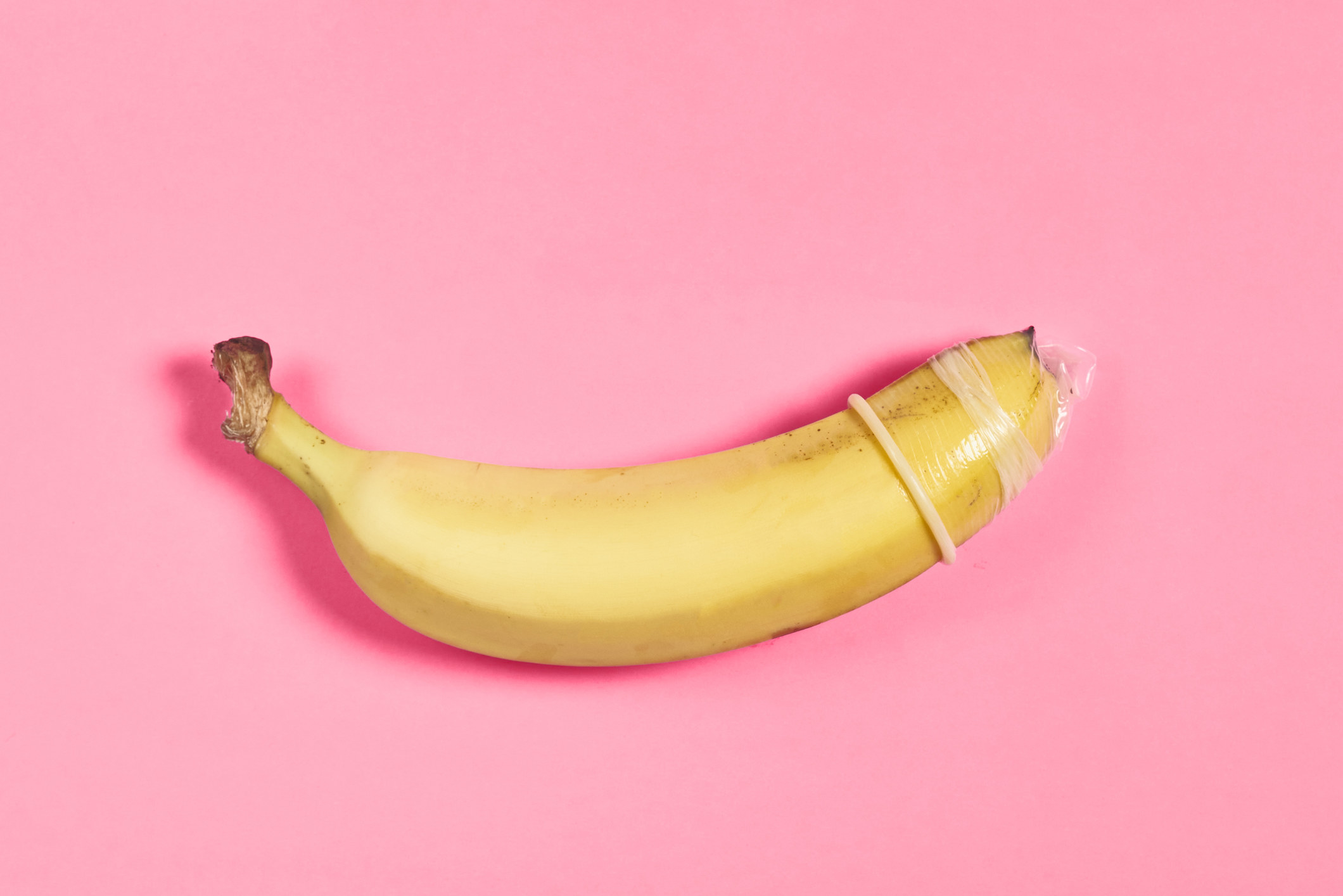 Stock image of a banana with a condom on it