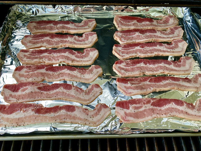 Bacon on foil on a baking sheet
