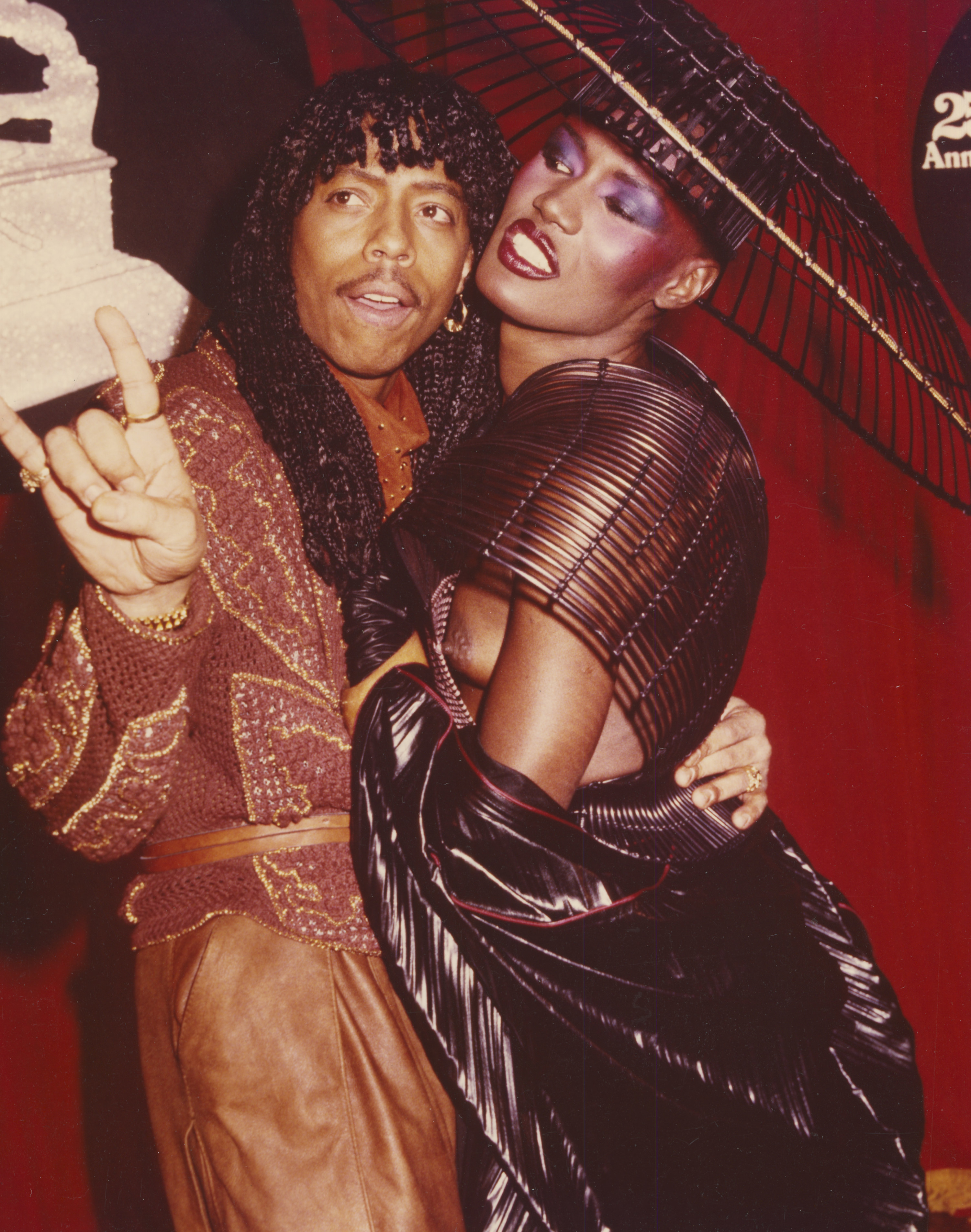 Rick James and Grace Jones posing together on the red carpet at the 25th Annual Grammy Awards