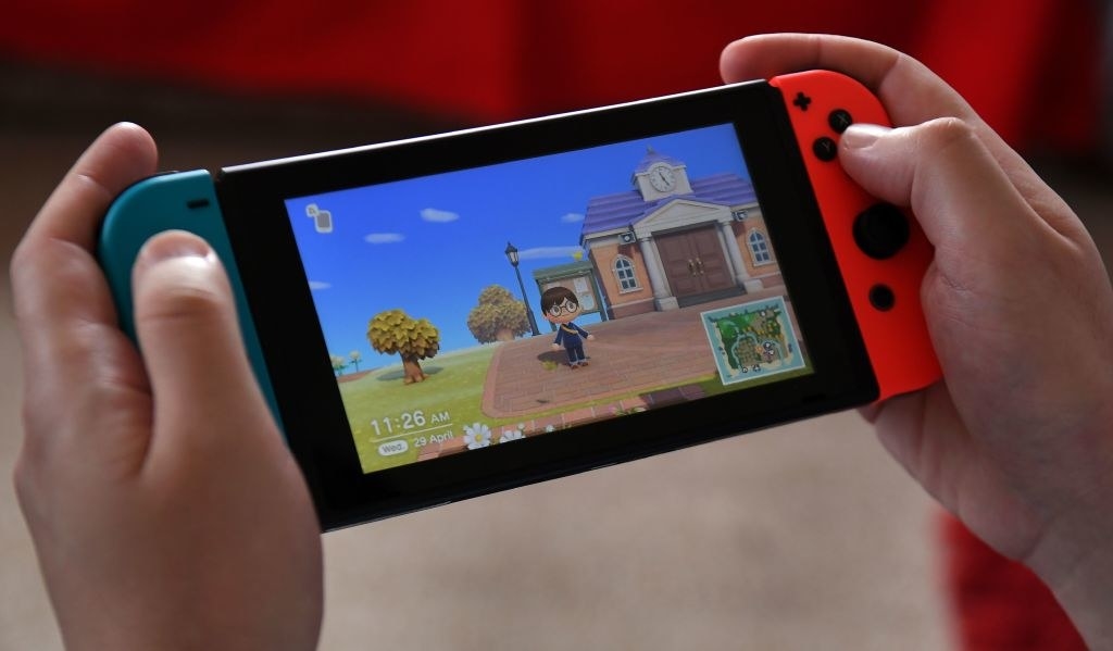 A person plays Animal Crossing on Nintendo Switch
