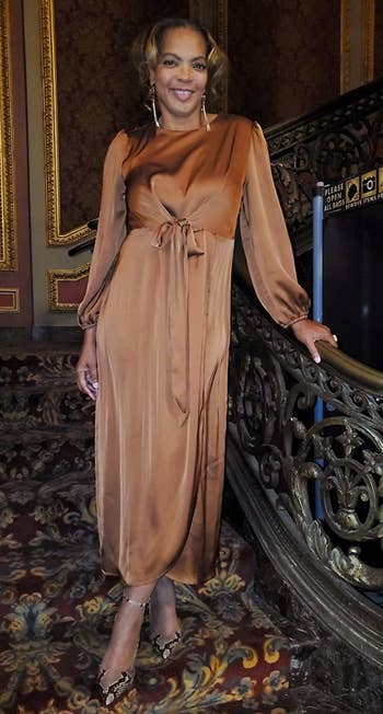 a different reviewer wearing the dress in brown