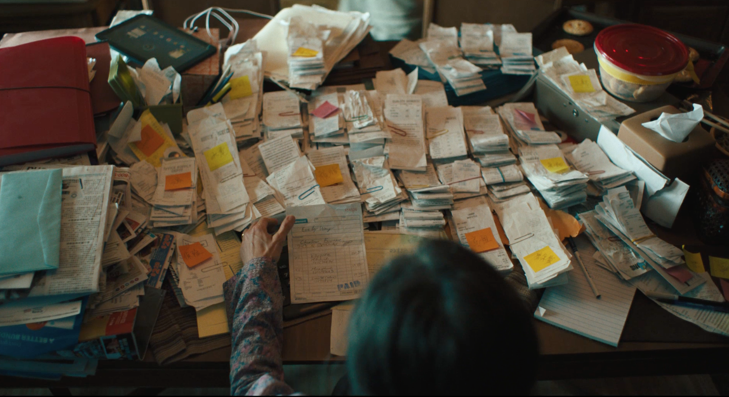 A table covered in receipts and sticky notes