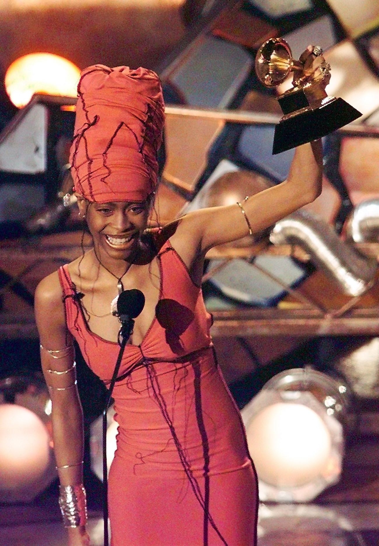 Erykah Badu holds up her Grammy after winning in the Best R&amp;B Category for her album &quot;Baduizm&quot;