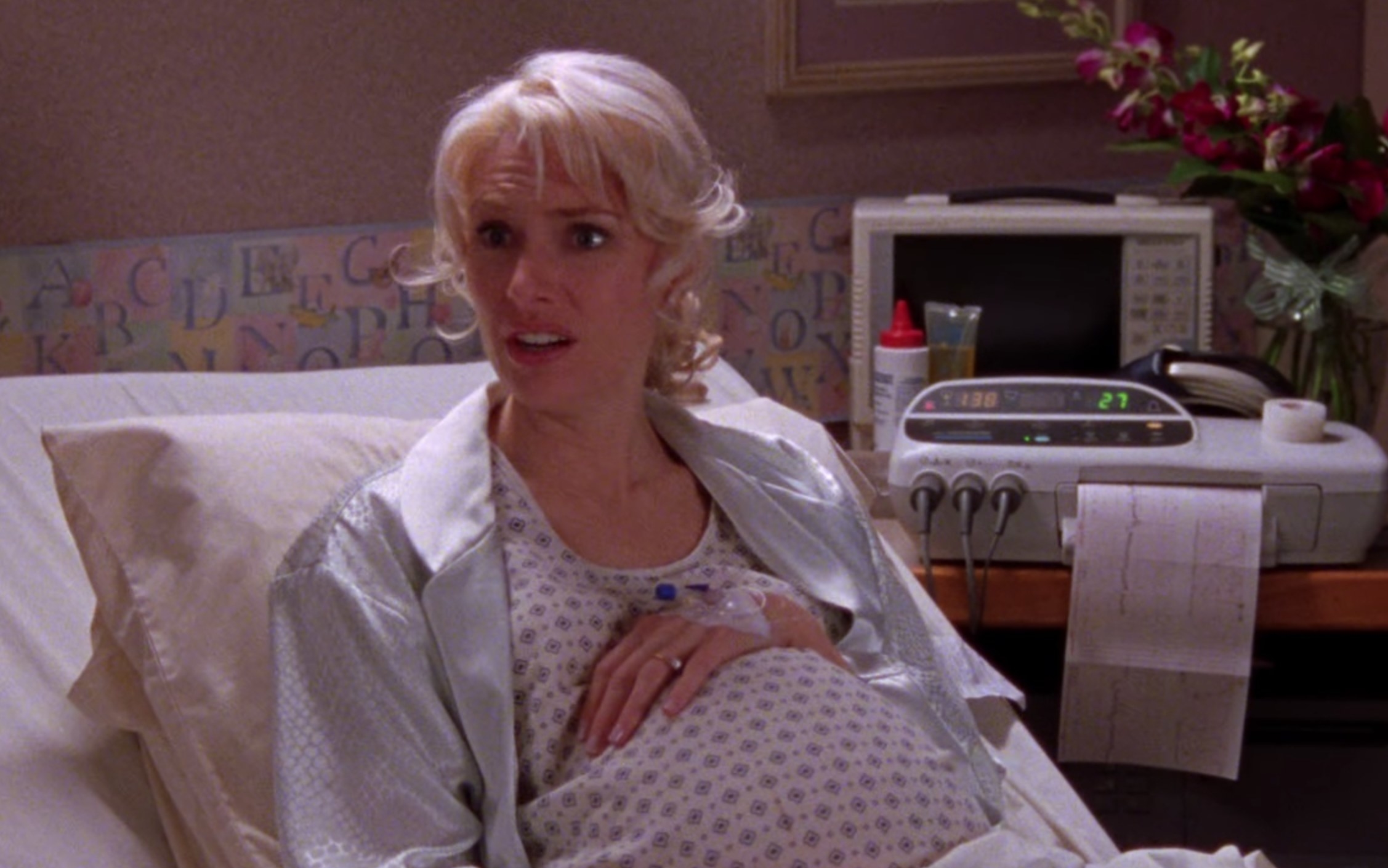 Sherry pregnant in a hospital bed